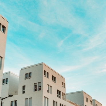 white concrete apartment during daytime