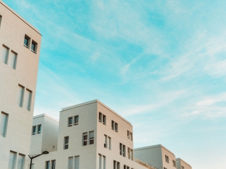 white concrete apartment during daytime