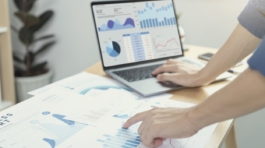 Businesspeople working in finance and accounting Analyze financial graph budget and planning for future in office room.