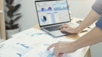 Businesspeople working in finance and accounting Analyze financial graph budget and planning for future in office room.