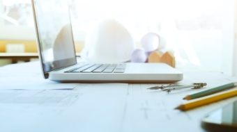 Construction and Repair work. Drawings for building Architectural project, blueprint rolls and divider compass on table. Engineering tools concept. Copyspace of Architecture and Engineer Desktop.